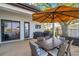 Covered patio with ample seating, outdoor cooking area, and waterfront view at 3598 10Th Ne St, St Petersburg, FL 33704