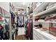 Organized walk-in closet with ample shelving, hanging space, and storage drawers at 3598 10Th Ne St, St Petersburg, FL 33704