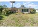 Spacious backyard with lush landscaping and plenty of room to enjoy outdoor living at 375 Magnolia Rd, Venice, FL 34293