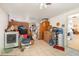 Unfinished basement with washer and dryer, storage items, and easy access to the kitchen at 375 Magnolia Rd, Venice, FL 34293