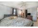 Comfortable bedroom featuring a ceiling fan, grey walls, and a closet at 375 Magnolia Rd, Venice, FL 34293