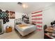A cozy bedroom with minimal furniture and eccentric decor at 375 Magnolia Rd, Venice, FL 34293