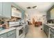 Functional kitchen with a full suite of appliances and direct access to a casual dining space at 375 Magnolia Rd, Venice, FL 34293