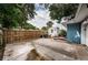 This backyard features a spacious concrete patio and a wooden fence for privacy at 3850 6Th N Ave, St Petersburg, FL 33713
