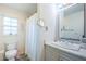 Cozy bathroom featuring patterned floors, a toilet, and a sink with white marble countertops at 3850 6Th N Ave, St Petersburg, FL 33713