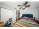 Bedroom with ceiling fan, office chair and closet at 3850 6Th N Ave, St Petersburg, FL 33713