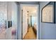 View through doorway into a bedroom with a large bed and bright teal accents at 3850 6Th N Ave, St Petersburg, FL 33713
