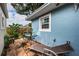 Backyard featuring a tiled patio with seating and greenery, by a light blue house at 3850 6Th N Ave, St Petersburg, FL 33713