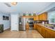 Well-equipped kitchen with stainless steel appliances, wooden cabinetry, and efficient layout at 3850 6Th N Ave, St Petersburg, FL 33713
