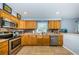A kitchen featuring stainless steel appliances, bright lighting, and ample cabinet space at 3850 6Th N Ave, St Petersburg, FL 33713