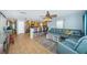Open-concept living room with a large sectional sofa and easy access to the kitchen and other areas at 3850 6Th N Ave, St Petersburg, FL 33713