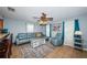Comfortable living room features a plush sofa, accent chair, and a decorative area rug at 3850 6Th N Ave, St Petersburg, FL 33713