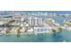 Wonderful aerial view showcasing the gorgeous waterfront condo community with boat docks and city views at 400 Island Way # 908, Clearwater Beach, FL 33767