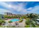 Aerial view of community pool and surrounding buildings at 400 Island Way # 908, Clearwater Beach, FL 33767