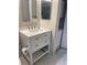 Bathroom featuring a vanity, mirror, and washing machine at 400 Island Way # 908, Clearwater Beach, FL 33767