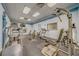 Fitness center with a variety of exercise equipment, TV and mirrors at 400 Island Way # 908, Clearwater Beach, FL 33767