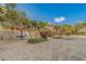 Community pool area with tiki hut seating and tables, lounge chairs and lush landscaping at 400 Island Way # 908, Clearwater Beach, FL 33767