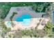 Aerial of hexagon-shaped community pool with sundeck, lounge chairs and a separate hot tub at 400 Island Way # 908, Clearwater Beach, FL 33767