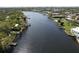 Beautiful aerial view of a waterfront community with lush greenery and private docks along the channel at 4035 N River View Ave, Tampa, FL 33607