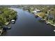 Stunning aerial view of waterfront property with private docks and lush landscaping at 4035 N River View Ave, Tampa, FL 33607