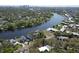 Expansive aerial view of waterfront properties surrounded by lush trees and tranquil river scenery at 4035 N River View Ave, Tampa, FL 33607