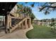 Entertainer's backyard with lush lawn, stone stairs, cabana, and waterfront access at 4035 N River View Ave, Tampa, FL 33607
