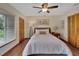 Bright bedroom with hardwood floors, a queen-size bed, and lots of closet space at 4035 N River View Ave, Tampa, FL 33607