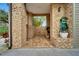 Elegant courtyard featuring stone walls, tiled flooring, and tasteful landscaping at 4035 N River View Ave, Tampa, FL 33607