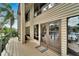 Exterior view of a home showing a spacious outdoor deck with access to the canal front at 4035 N River View Ave, Tampa, FL 33607