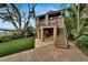 Multi-level home featuring a backyard oasis with covered patios, stairs to the main level, and access to the dock at 4035 N River View Ave, Tampa, FL 33607