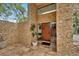 Welcoming front entrance with custom wood door, stone accents and elegant tile flooring at 4035 N River View Ave, Tampa, FL 33607