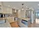 Bright kitchen featuring granite counters, stainless appliances, and kitchen island at 4035 N River View Ave, Tampa, FL 33607