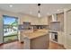 Updated kitchen with an island, granite countertops, and stainless steel appliances at 4035 N River View Ave, Tampa, FL 33607