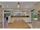 Spacious kitchen with center island, granite countertops, and ample cabinetry at 4035 N River View Ave, Tampa, FL 33607