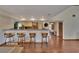 Stylish open kitchen with bar seating and updated backsplash, seamlessly connects to the living area at 4035 N River View Ave, Tampa, FL 33607