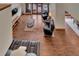 Open living room featuring rich hardwood floors, comfortable seating, and stylish modern decor at 4035 N River View Ave, Tampa, FL 33607