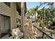 Multi-level deck showcasing outdoor seating and a built-in grill, overlooking tropical landscaping at 4035 N River View Ave, Tampa, FL 33607