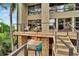 Multi-level outdoor space with stone accents, stairs to upper deck and tropical foliage at 4035 N River View Ave, Tampa, FL 33607