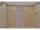 Tiled shower space features a dual shower head and shelving at 4035 N River View Ave, Tampa, FL 33607