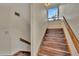 Staircase with wood treads and a window to let the light shine through at 4035 N River View Ave, Tampa, FL 33607