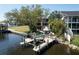 Waterfront property featuring a private dock, boat lift, and beautifully landscaped backyard, ideal for outdoor entertaining at 4035 N River View Ave, Tampa, FL 33607