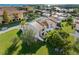 Aerial view of a coastal community featuring lush landscaping, residences, and waterway views at 4358 Outrigger Ln, Tampa, FL 33615