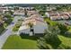 Community aerial view featuring well-maintained lawns and homes near a body of water at 4358 Outrigger Ln, Tampa, FL 33615