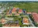 Aerial view of a condo community with mature landscaping, ponds, and a pool in a desirable area at 4358 Outrigger Ln, Tampa, FL 33615