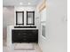 Modern bathroom featuring a double vanity, marble tiling and flooring, and large window for natural light at 4358 Outrigger Ln, Tampa, FL 33615