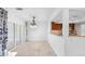 Bright, airy dining area featuring tile floors, a stylish chandelier, and seamless access to the outdoor patio at 4358 Outrigger Ln, Tampa, FL 33615
