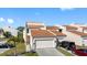 Charming townhouse features a well-manicured lawn, private driveway, and durable metal roof at 4358 Outrigger Ln, Tampa, FL 33615