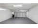 Clean, spacious two car garage with painted floor and walls; ideal for storage and parking at 4358 Outrigger Ln, Tampa, FL 33615