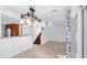 Open-concept living area with a staircase, stylish lighting, and sliding glass doors to the exterior at 4358 Outrigger Ln, Tampa, FL 33615