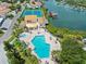 Aerial view of the large community pool, hot tub, tennis courts, and boat docks at 4358 Outrigger Ln, Tampa, FL 33615